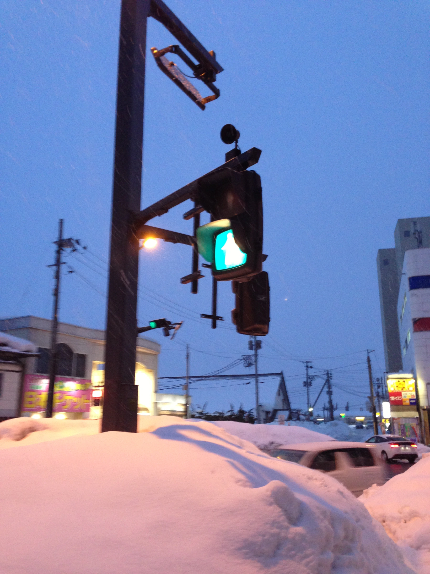 Traffic lights partially buried in snow